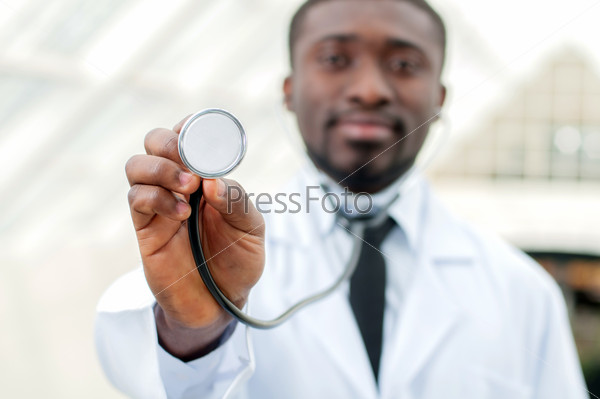 Young doctor standing with his stethoscope around his neck