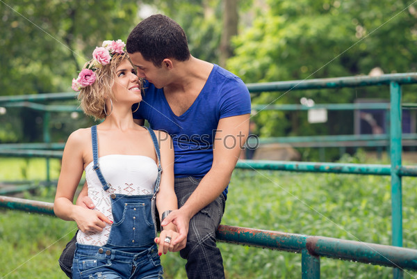 Copy-spaced image of a young couple in-love outside