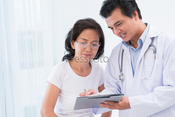 Close-up image of a doctor explaining diagnostics results to his patient