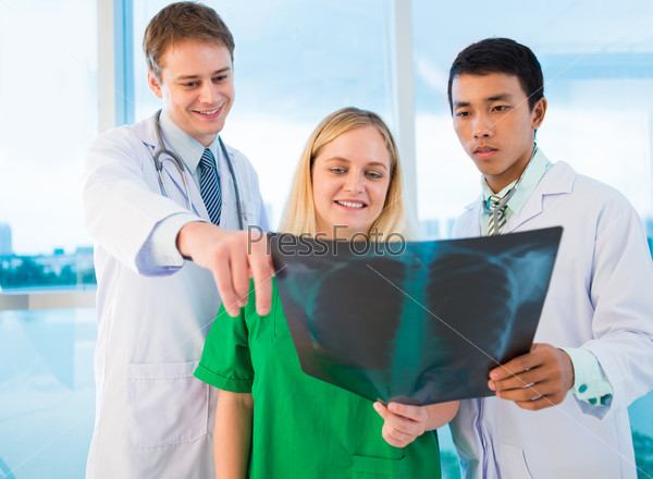 Doctors making an x-ray analysis