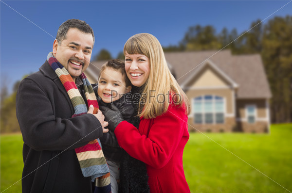 Smiling Mixed Race Family in Front of House