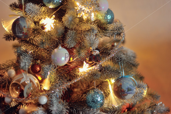 colorful bright and beautiful Christmas tree decorated with New Year\'s toys on the new year
