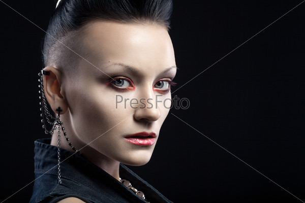 Portrait of young woman isolated on black background