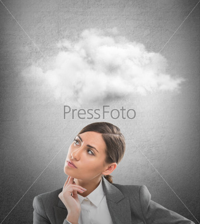 Close up of young business woman looking up for thought bubble above her head with copy space