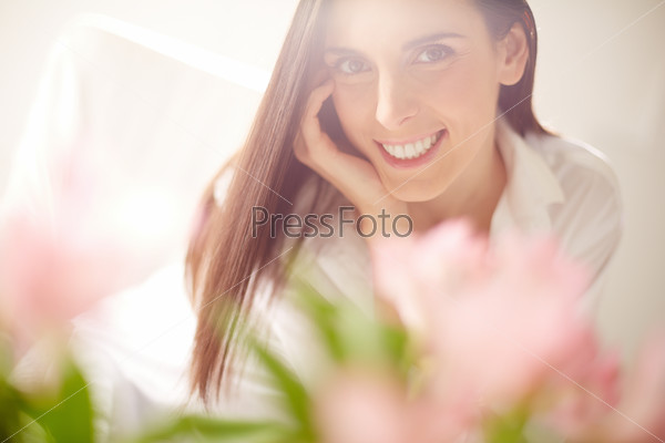 Portrait of lovely lady looking at camera with toothy smile
