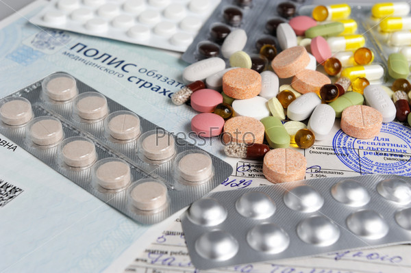 The tablets on the background of medical insurance and prescription close, stock photo