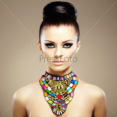 Portrait Of Young Beautiful Woman With Jewelry. Beauty Photo