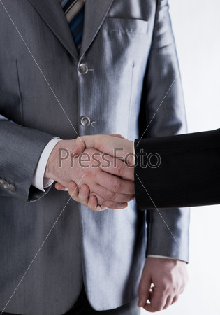 signing of the agreement and a handshake on white background
