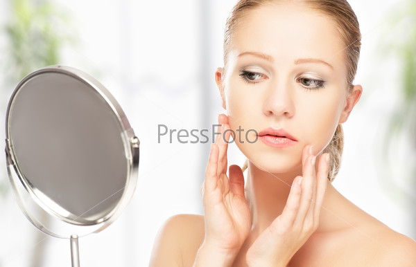 Face Of Young Beautiful Healthy Woman And Reflection In The Mirror