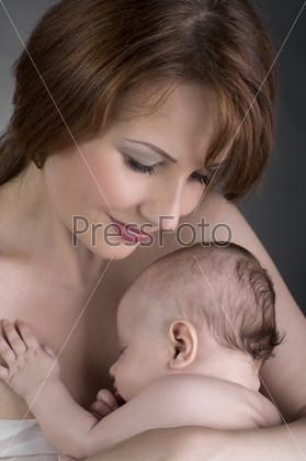 Baby sleep in mother arms