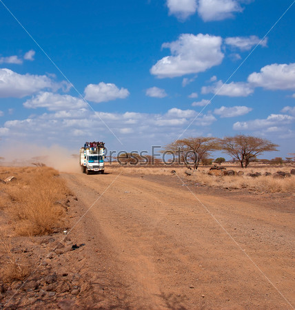 Car with people in the African desert