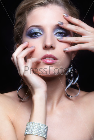 Beautiful young woman with vogue shining sparkle face makeup