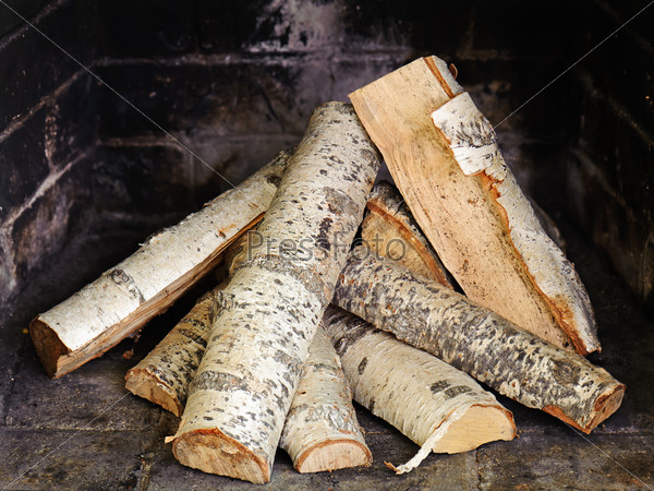 Fireplace with birch wood. Ready to light the flame, stock photo