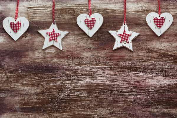 Shabby chic wooden shapes on rustic background