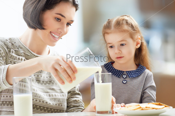 Girl Drinking Milk At The Kitchen
