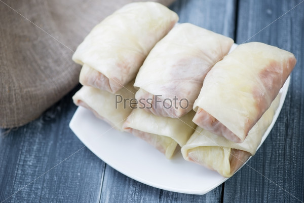 Unprepared cabbage rolls stuffed with ground meat and rice