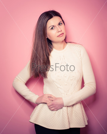 beautiful, young woman poses in studio, looks in a camera, emotions. Vogue style