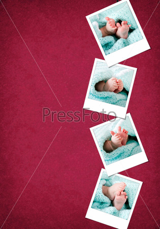 Happy and funny baby feet in blue-green blanket hanging vertical on a red-burgundy color grunge background.