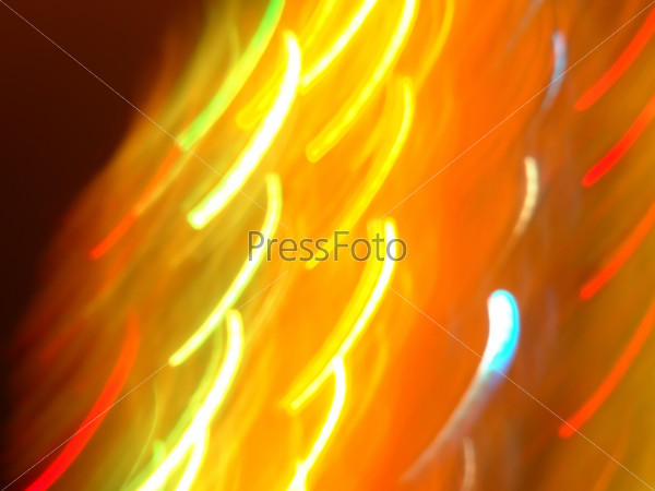 Abstract colorful light streaks texture with dark background.