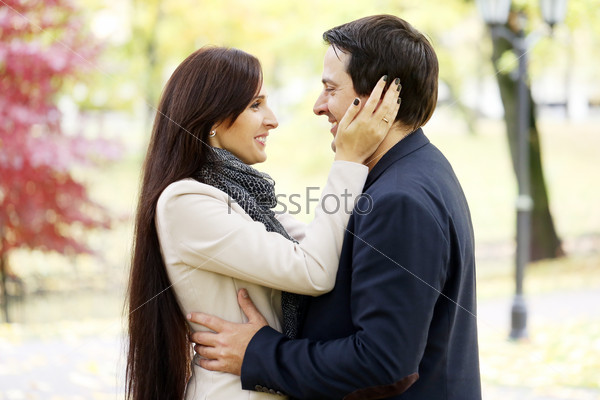 Adult couple having a good family day in the park, stock photo