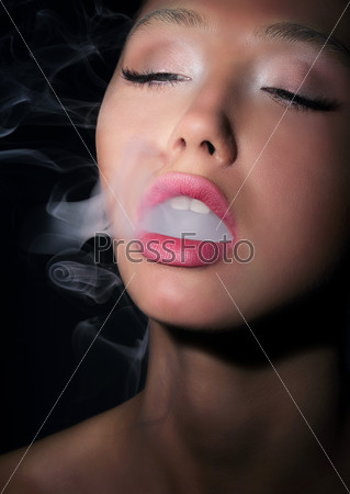 Dependence. Addiction. Woman Smoker Exhales Smoke of Cigarette