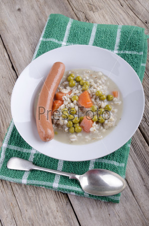 pearl barley soup with sausage, carrots and pea