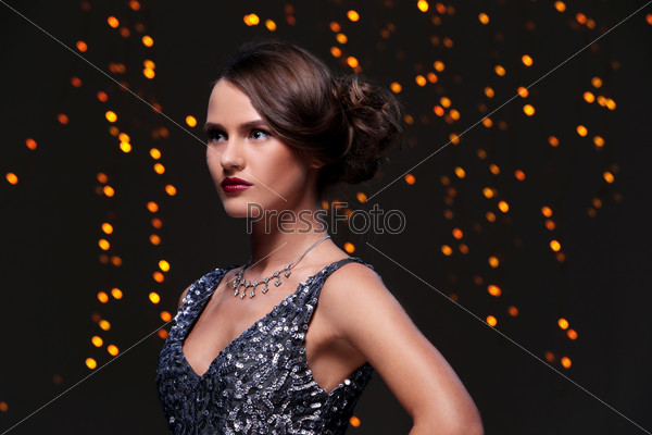 Woman with beautiful hairstyle at new year party celebration, stock photo