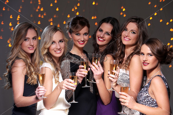 Girls with a glass of champagne meet new year