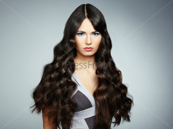 Portrait young beautiful woman with curly hair. Fashion photo, stock photo