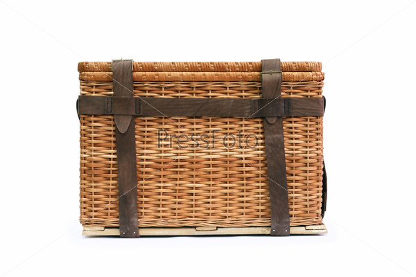 Ancient mobile wicker box with leather belts. Isolated on\
white with clipping path