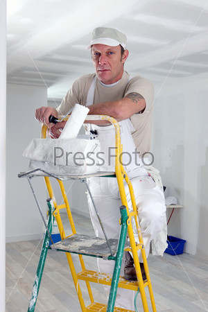 Painter climbing ladder