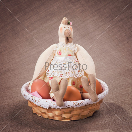 Textile handmade toy: chicken with eggs in the nest