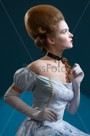 Theatre. Fairy Tale. Fancy woman in a blue dress - Retro Hairstyle. Medieval Fantasy.