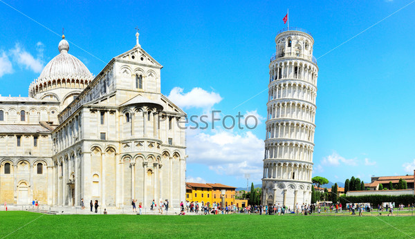 Tourist visiting the leaning tower of Pisa , Italy