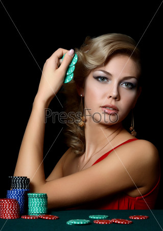 Beautiful woman with casino chips a black