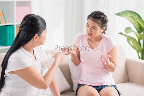 Close-up of a daughter and her mother talking heart-to-heart to solve the difficult situation between them