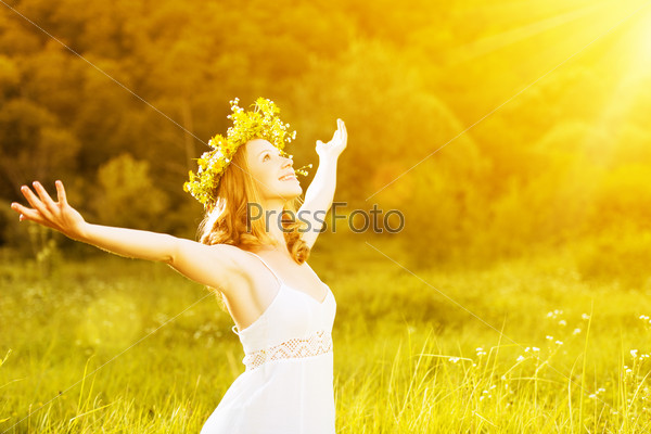 happy woman in wreath outdoors summer enjoying life opening hands