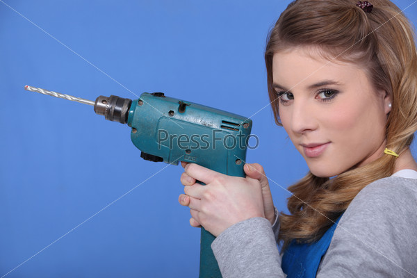 Woman holding power drill