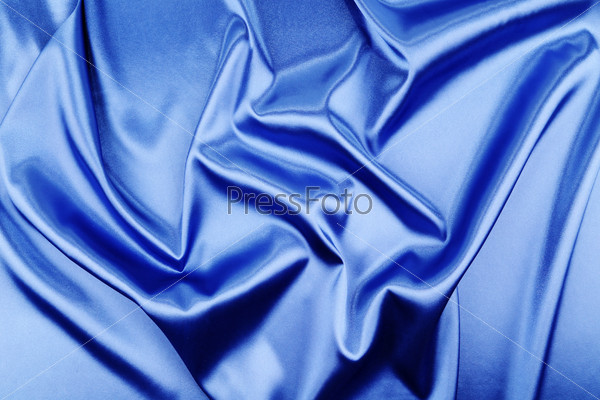 Blue silk background with some soft folds and highlights