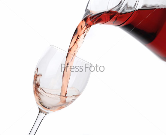Rose wine pouring from glass jar. Isolated on a white background.