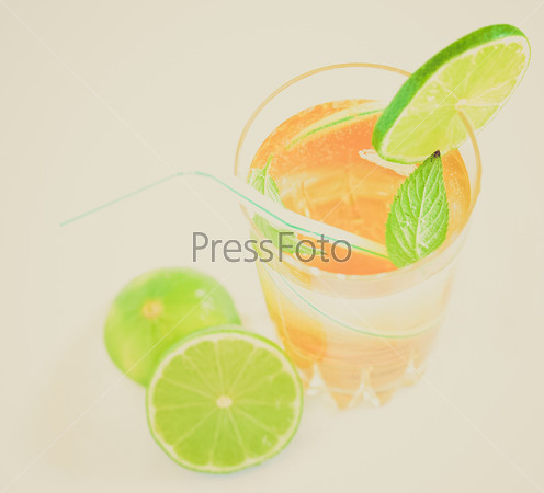Vintage retro looking Cocktail mixed alcoholic drink with lime and peppermint