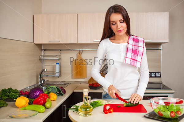 Kitchen woman making salad
