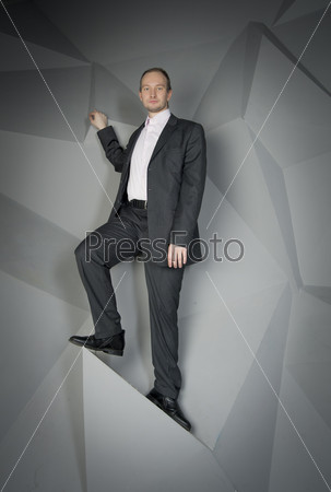 man in a suit and tie on the geometric background