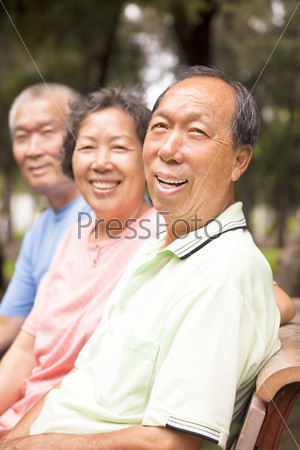 relaxed asian seniors in the park