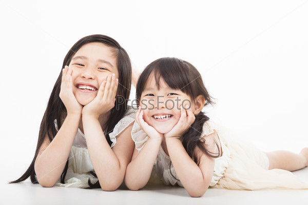 happy two asian girls on the white background