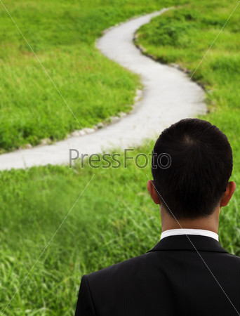 Business man thinking and watching the curved road