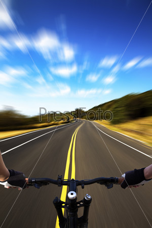 Bicycle rider with high speed view on the road