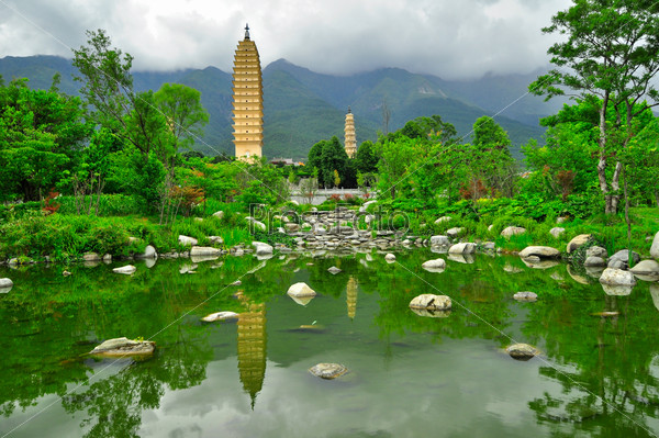 Rebuild Song dynasty town in dali, Yunnan province, China. Three pagodas and water with reflection, stock photo