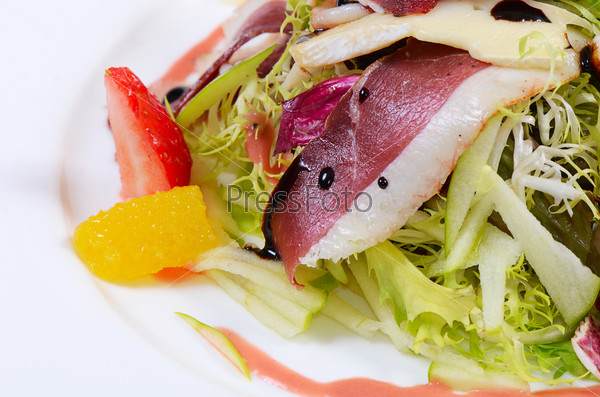 Salad with smoked duck breast close up