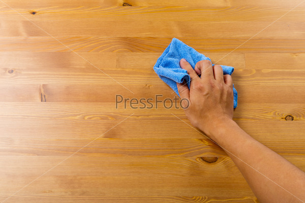 Cleaning table by hand